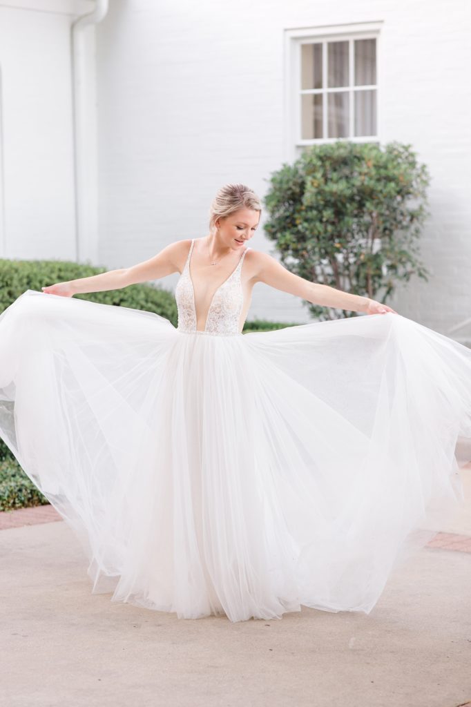 Courtney Bosworth Photography photographs bride showing off wedding gown
