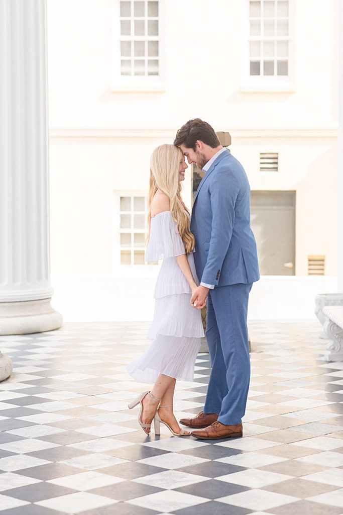 engaged couple stands foreheads touching during Charleston engagement photos