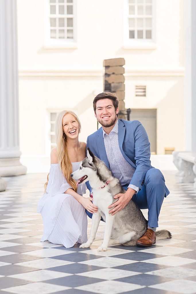 engaged couple holds husky during portraits with Courtney Bosworth Photography