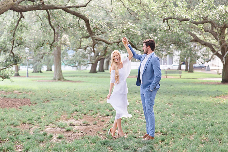 couple dances in park during South Carolina engagement portraits