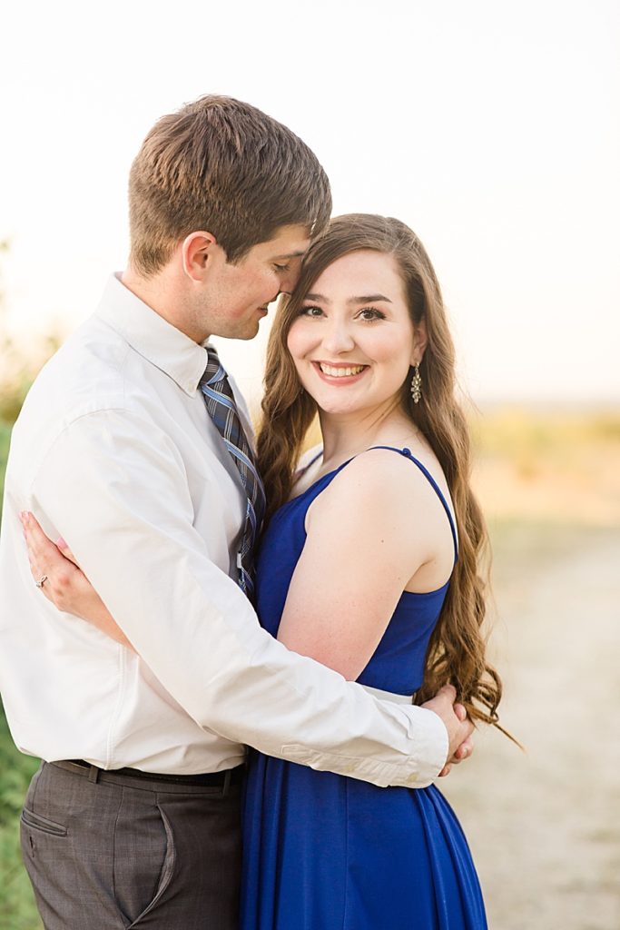 couple in blue dress and shirt photographed by Courtney Bosworth Photography