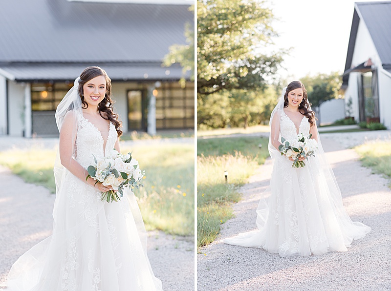 bride stands in front of barn at Mae's Ridge