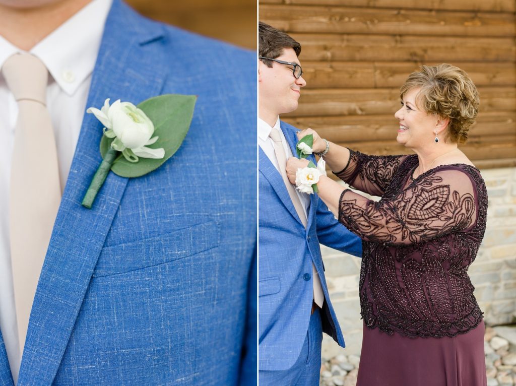 groom has boutonnière pinned on by mother