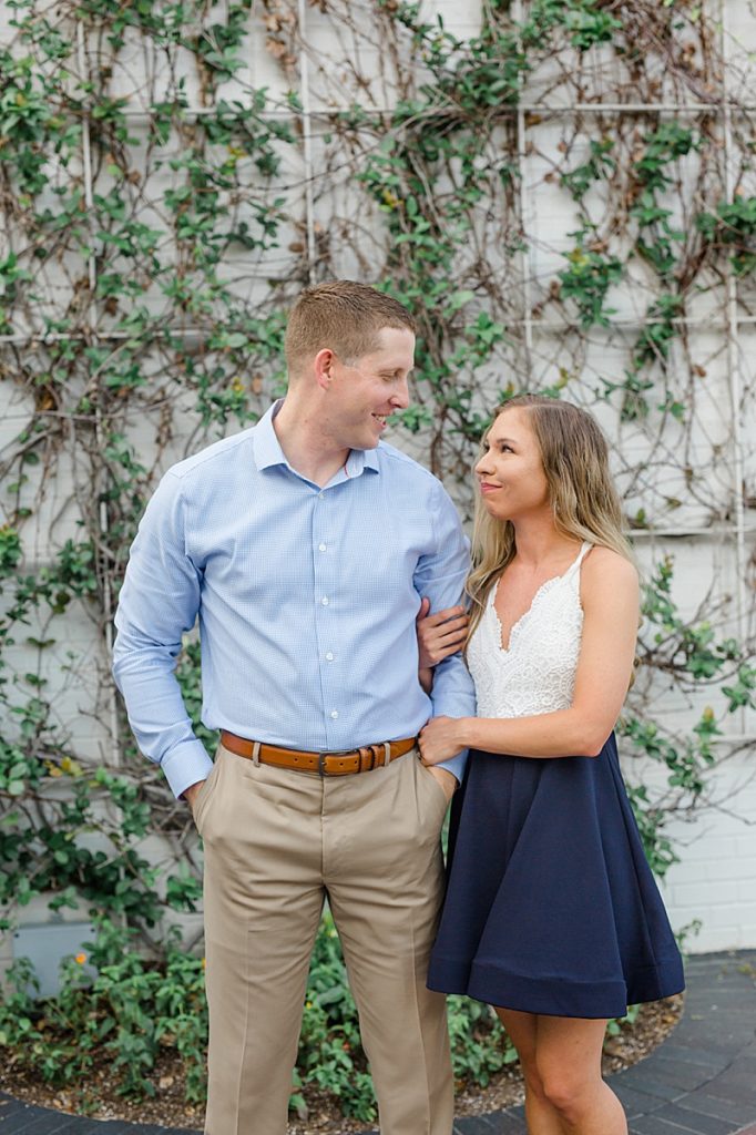 Texas engagement session along ivy covered wall