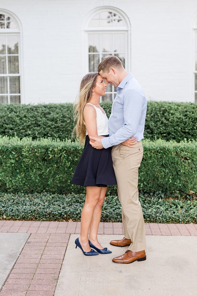 Texas bride and groom pose for engagement session at Arlington Hall at Lee Park