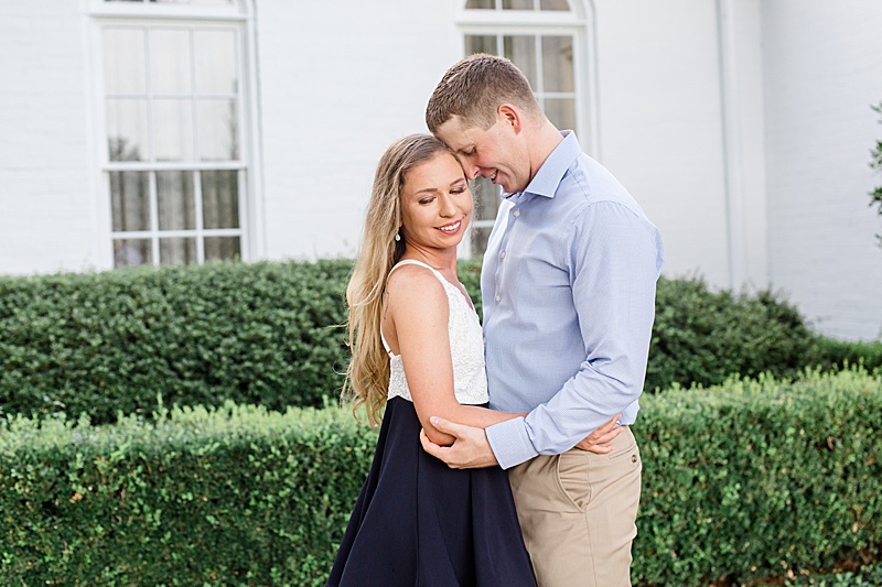 groom nuzzles bride during TX engagement session