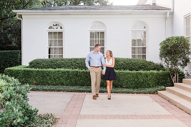 engaged couple walks through gardens in Dallas