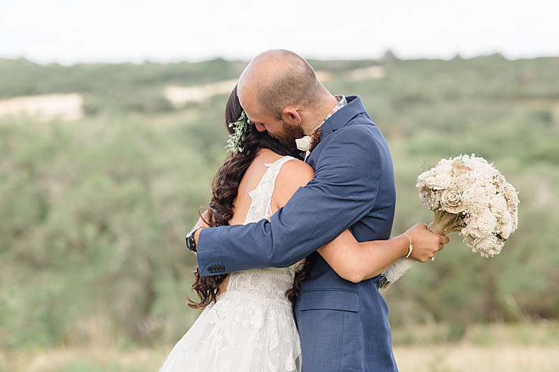 bride and brother hug during Austin Texas wedding