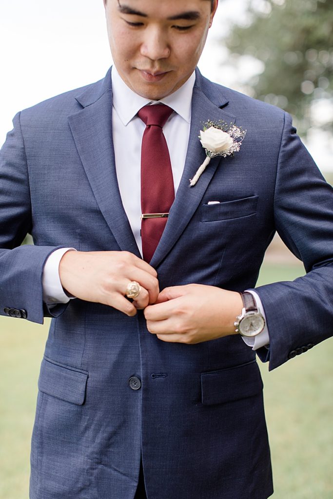 summer groom's attire, navy suit with red tie