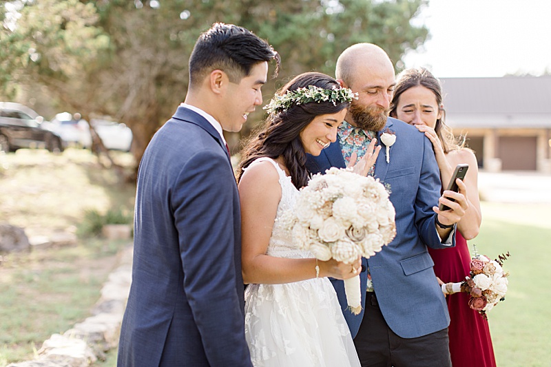 bride and groom call parents in Hawaii