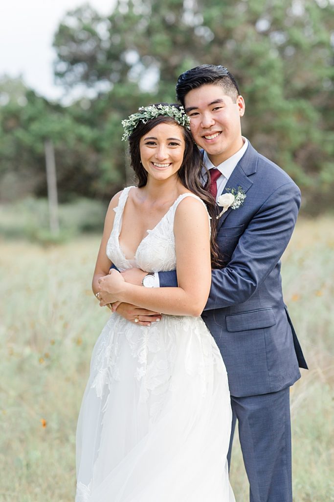 Austin Texas wedding portraits of newlyweds in field