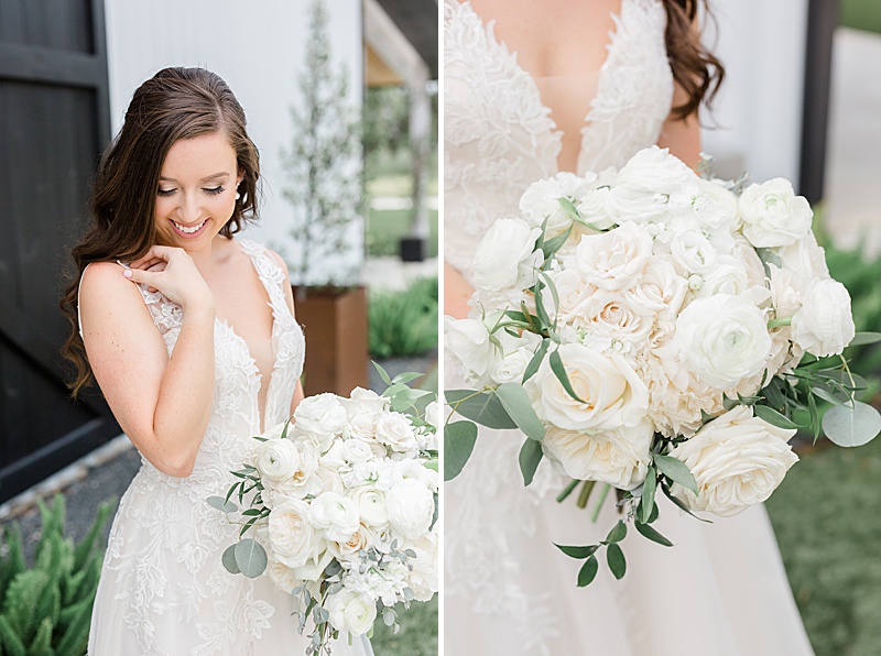 bride with bouquet of white flowers smiles at the ground