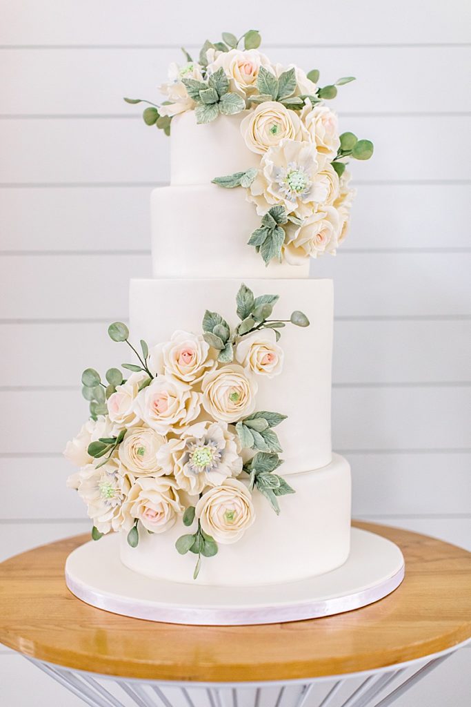 wedding cake with ivory flowers