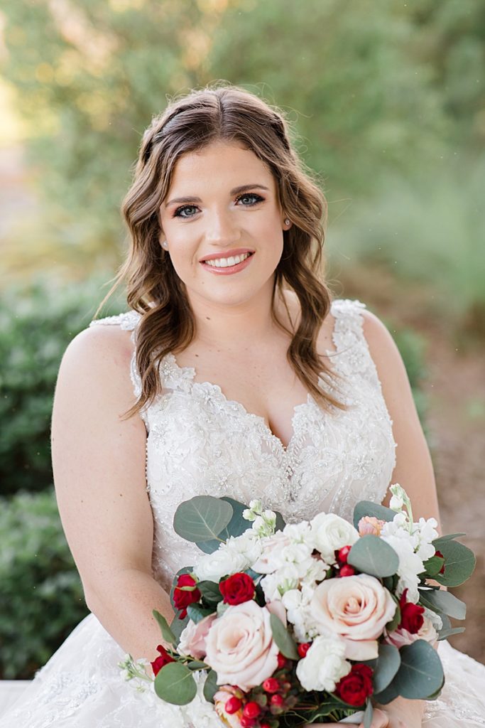 bride holds bouquet in front of her