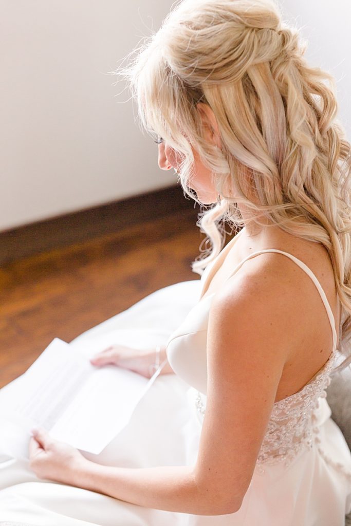 bride reads letter from groom on wedding day