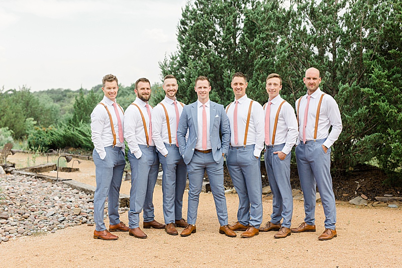 groom with groomsmen in suspenders