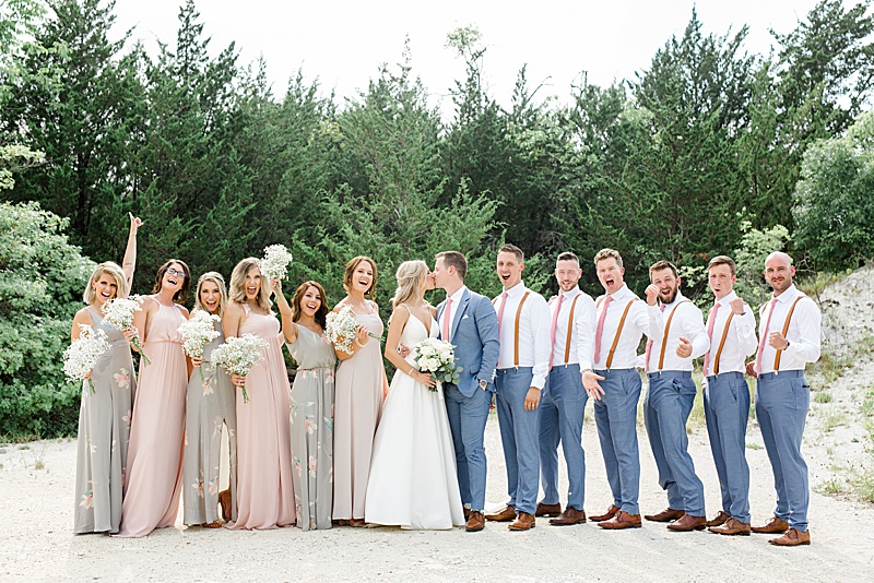 Texas bridal party poses with bride and groom