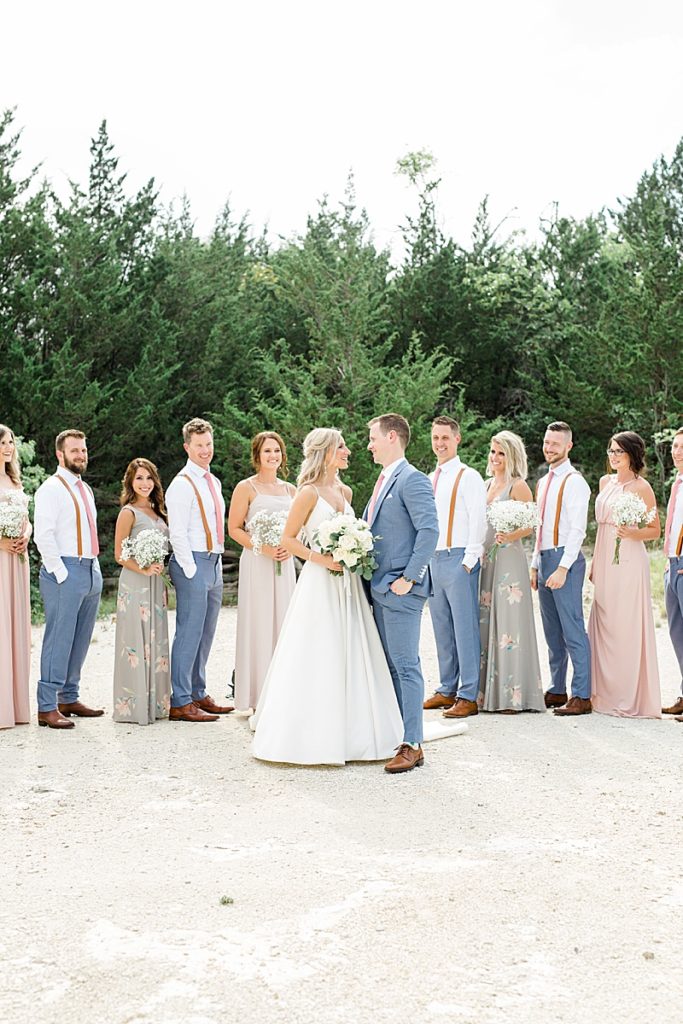 wedding party in Texas with mismatched gowns and navy suits