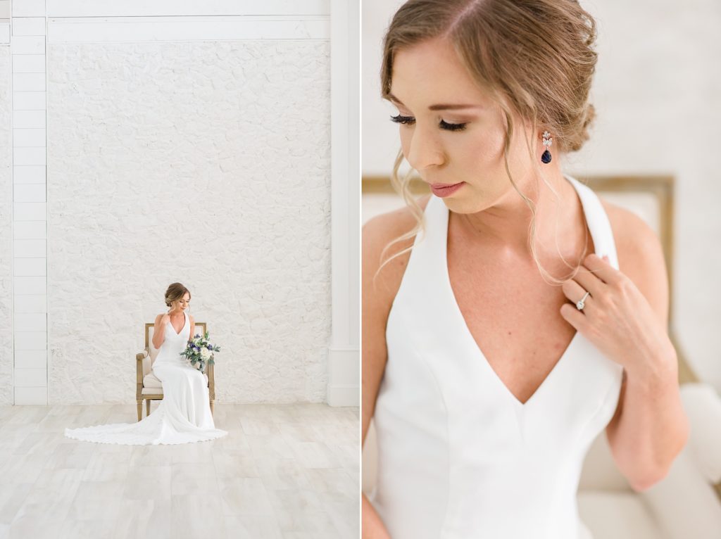 bride holds bouquet siting in chair by white wall