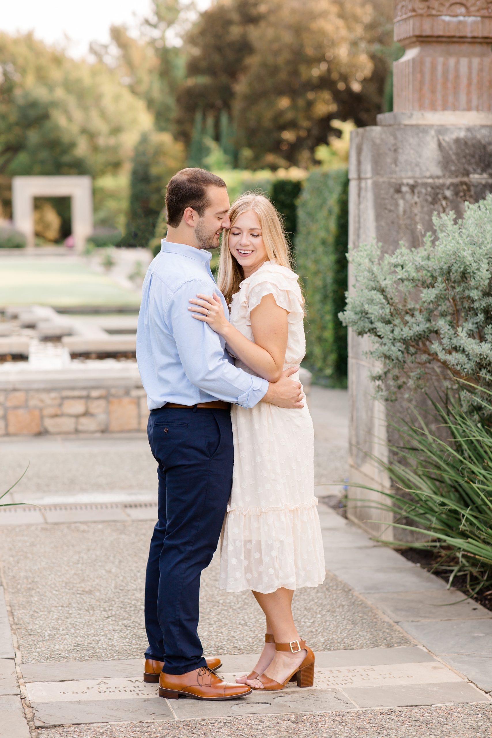groom kisses bride during engagement photos