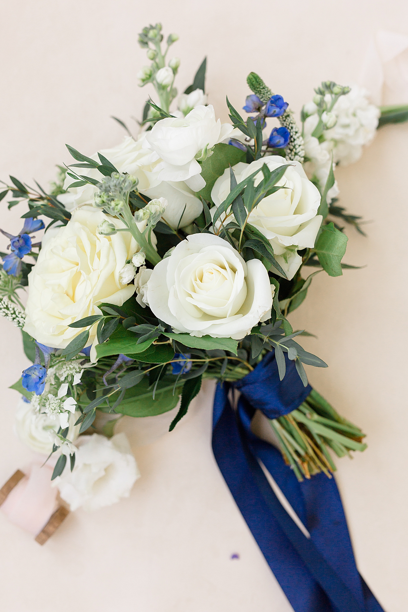 wedding bouquet for summer wedding with white roses and bluebells