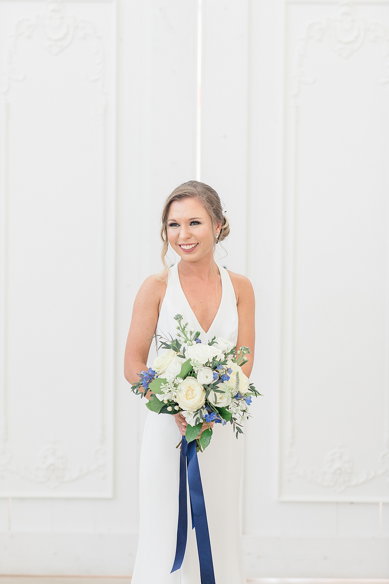 The Nest at Ruth Farms bridal portraits with bride holding ivory bouquet