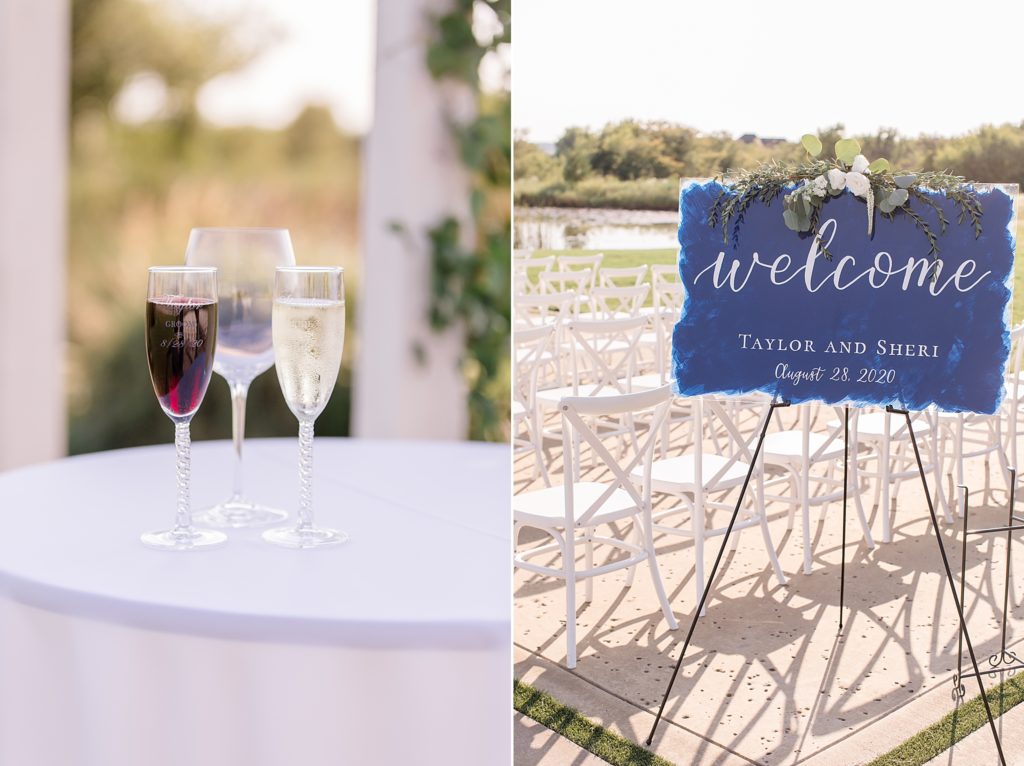 sunset wedding ceremony details including blue sign and wine