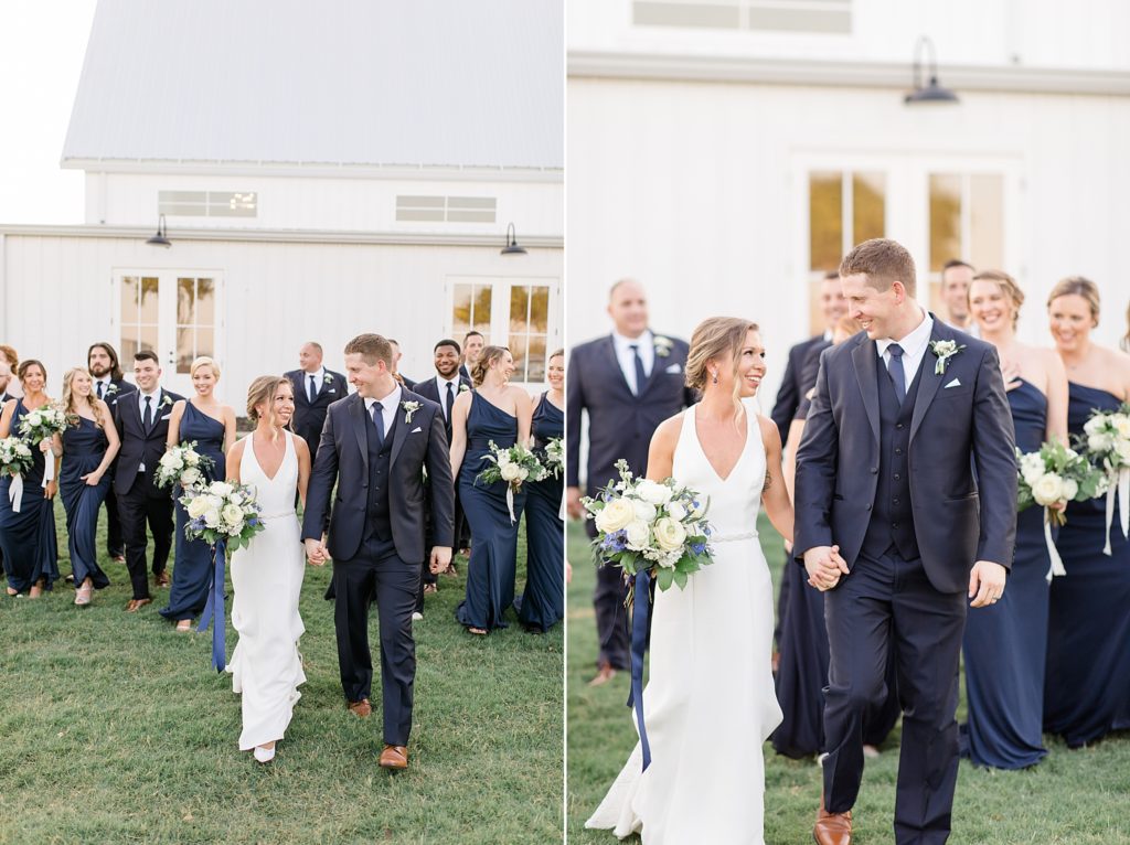 newlyweds look at each other while wedding party walks behind them at Dallas TX venue