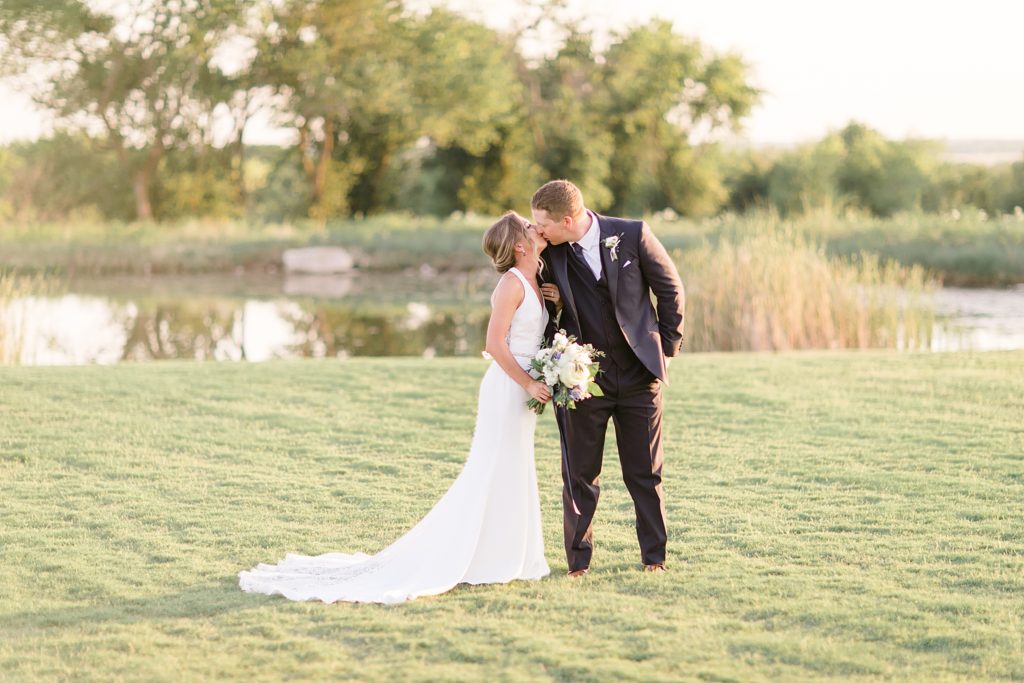 Texas wedding portraits by pond at The Nest at Ruth Farms