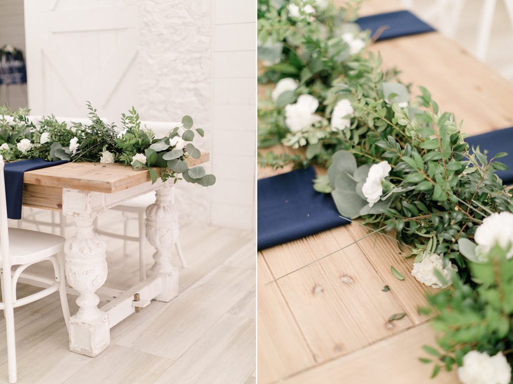 navy place settings with greenery table runner