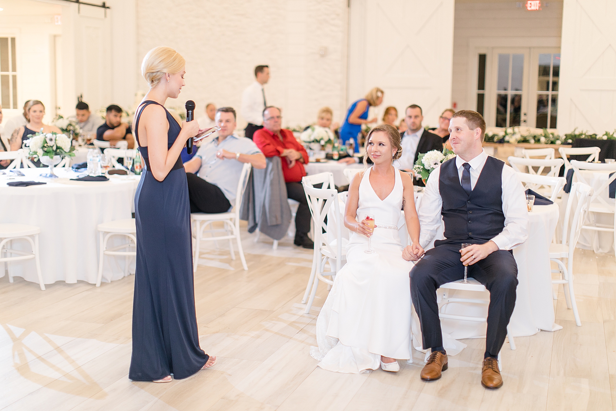 maid of honor gives to toast to newlyweds