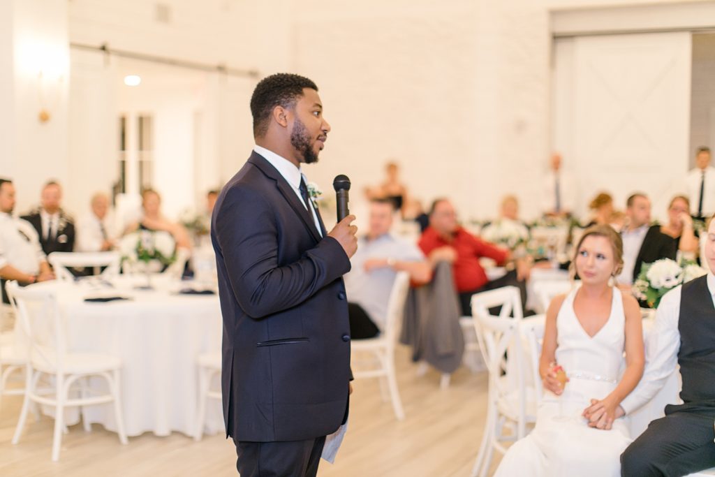 Best man gives toast to bride and groom