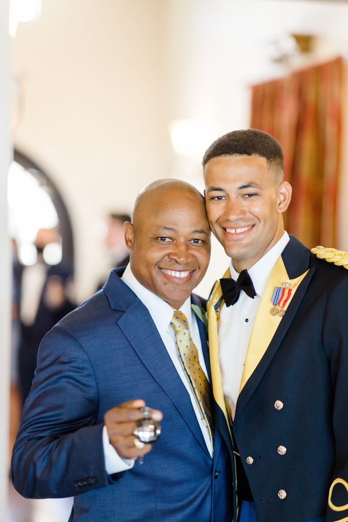 groom poses with dad
