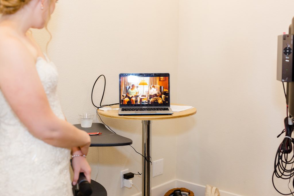 bride and groom talk to guests on video call