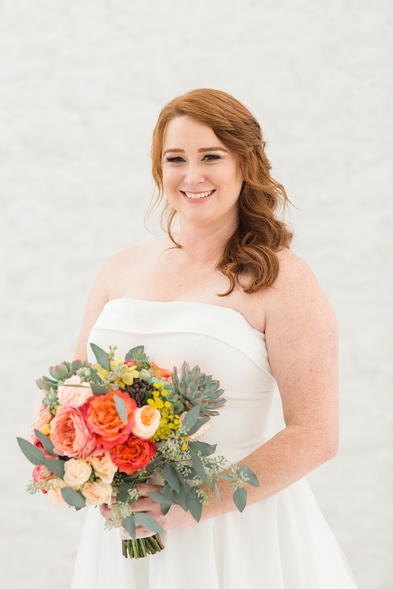 bride holds bouquet during The Nest at Ruth Farms bridal session