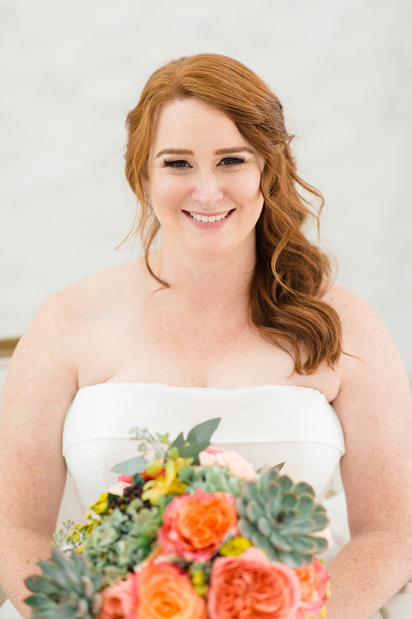 bride smiles at photographer during Texas bridal session