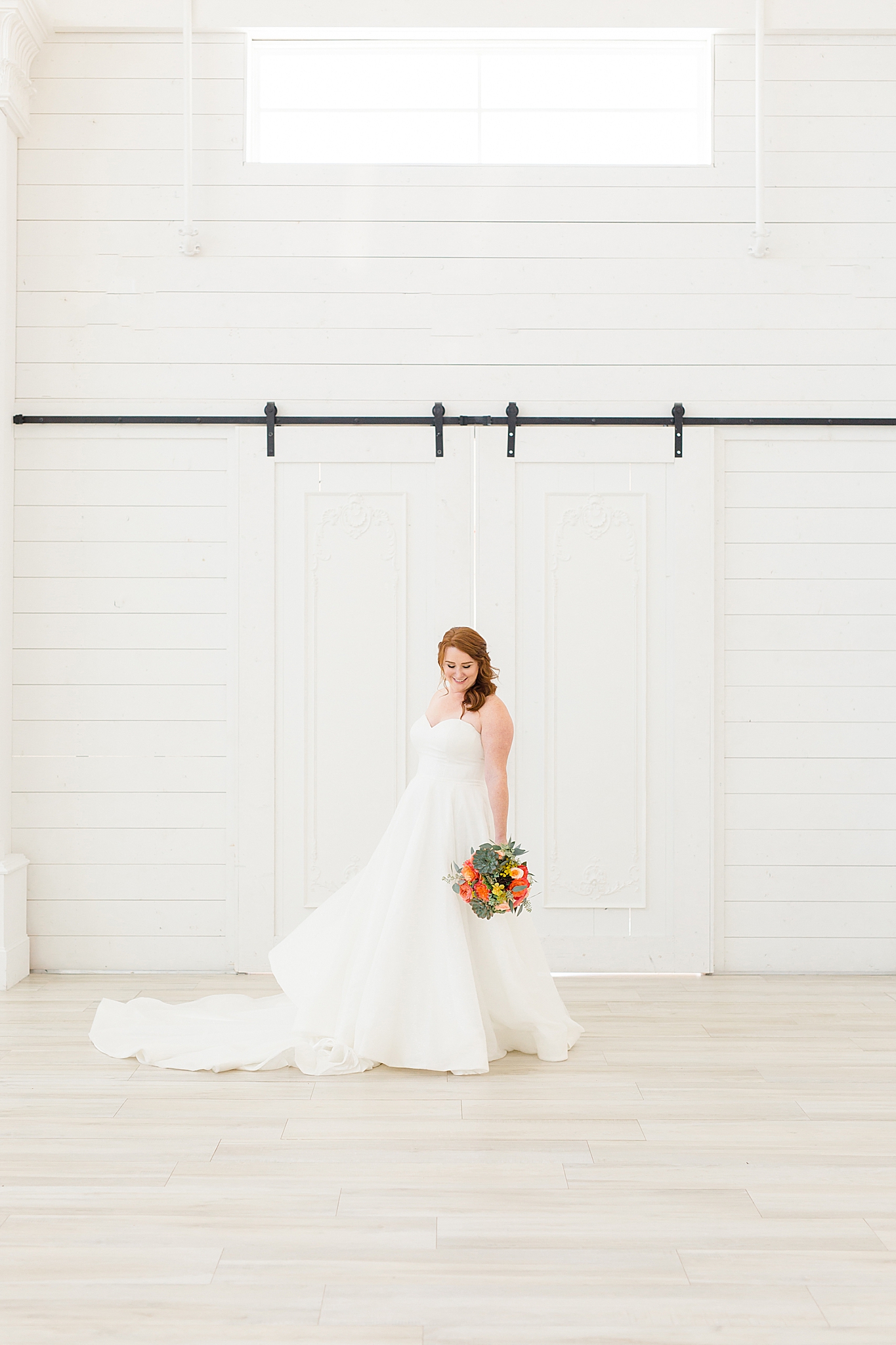 bride twirls wedding dress during The Nest at Ruth Farms bridal session