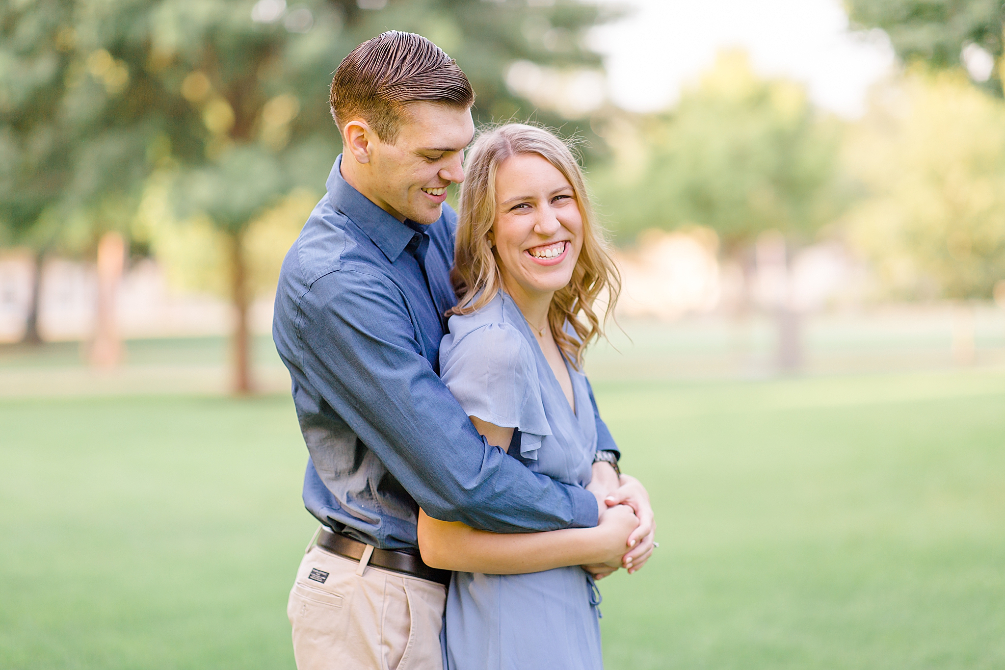 groom makes bride laugh during TX engagement session