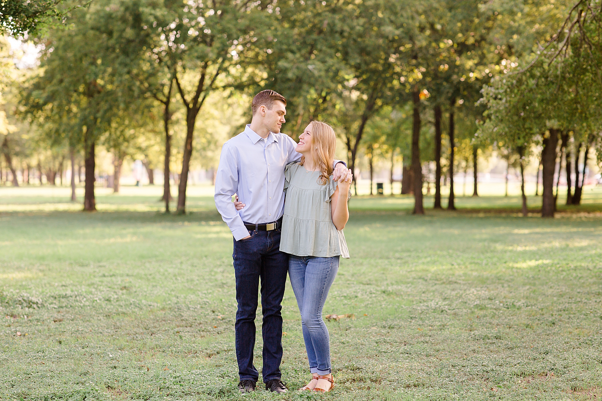 bride and groom look at each other during Texas engagement photos