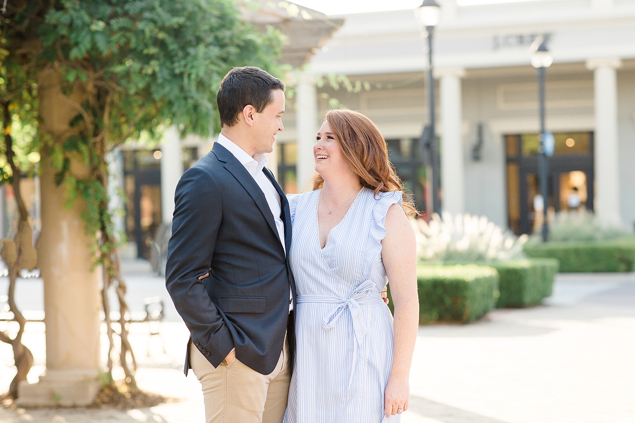 engaged couple looks at each other during Southlake Town Square engagement photos