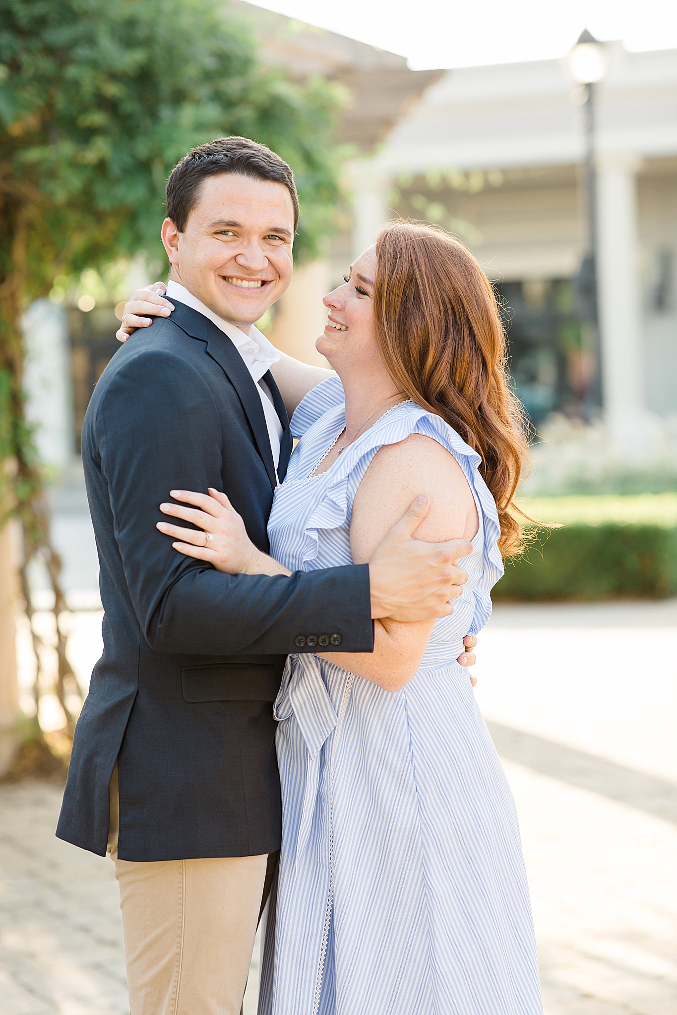 bride looks at groom during TX engagement portraits