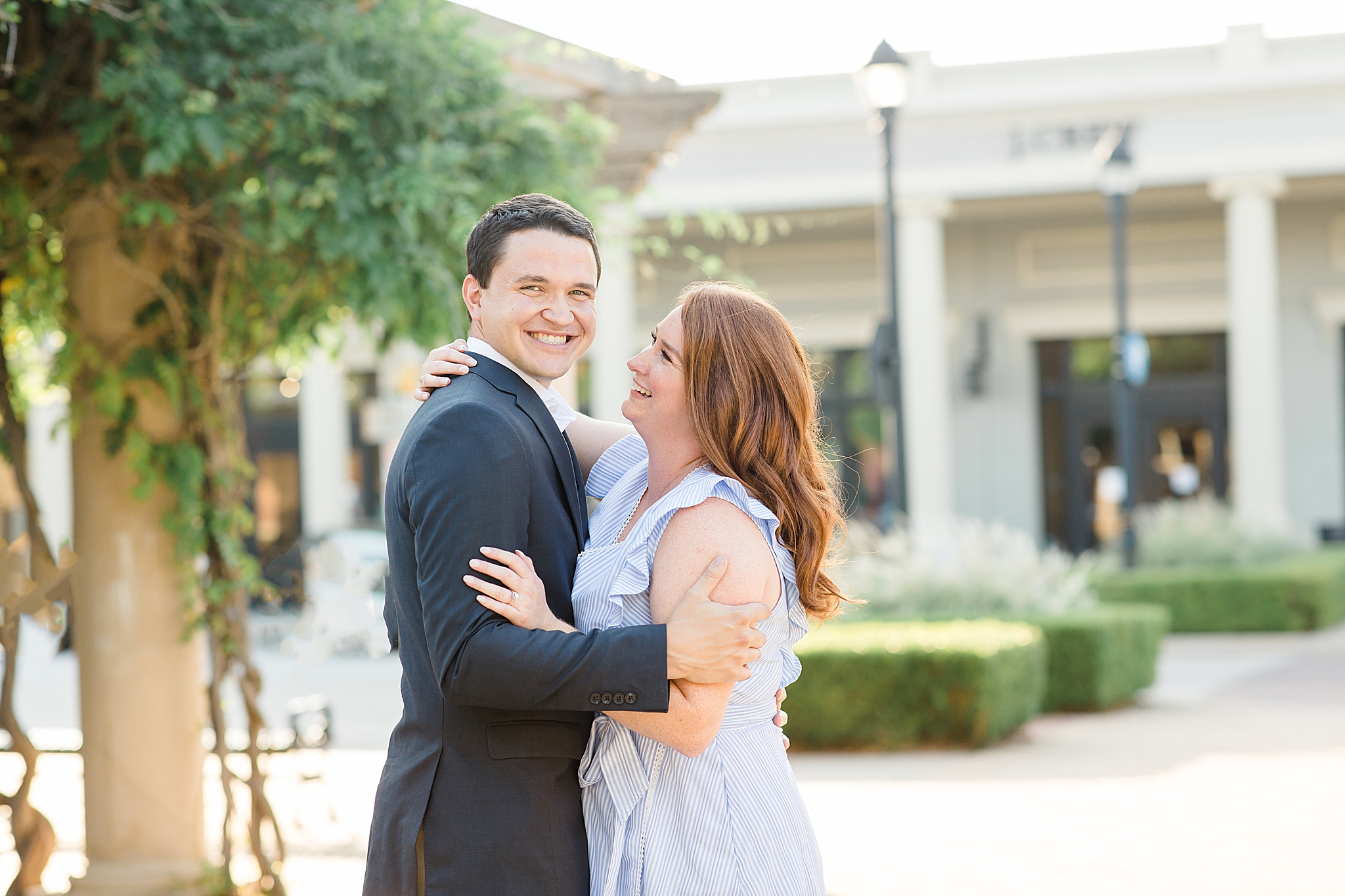 bride and groom laugh during Southlake Town Square engagement session
