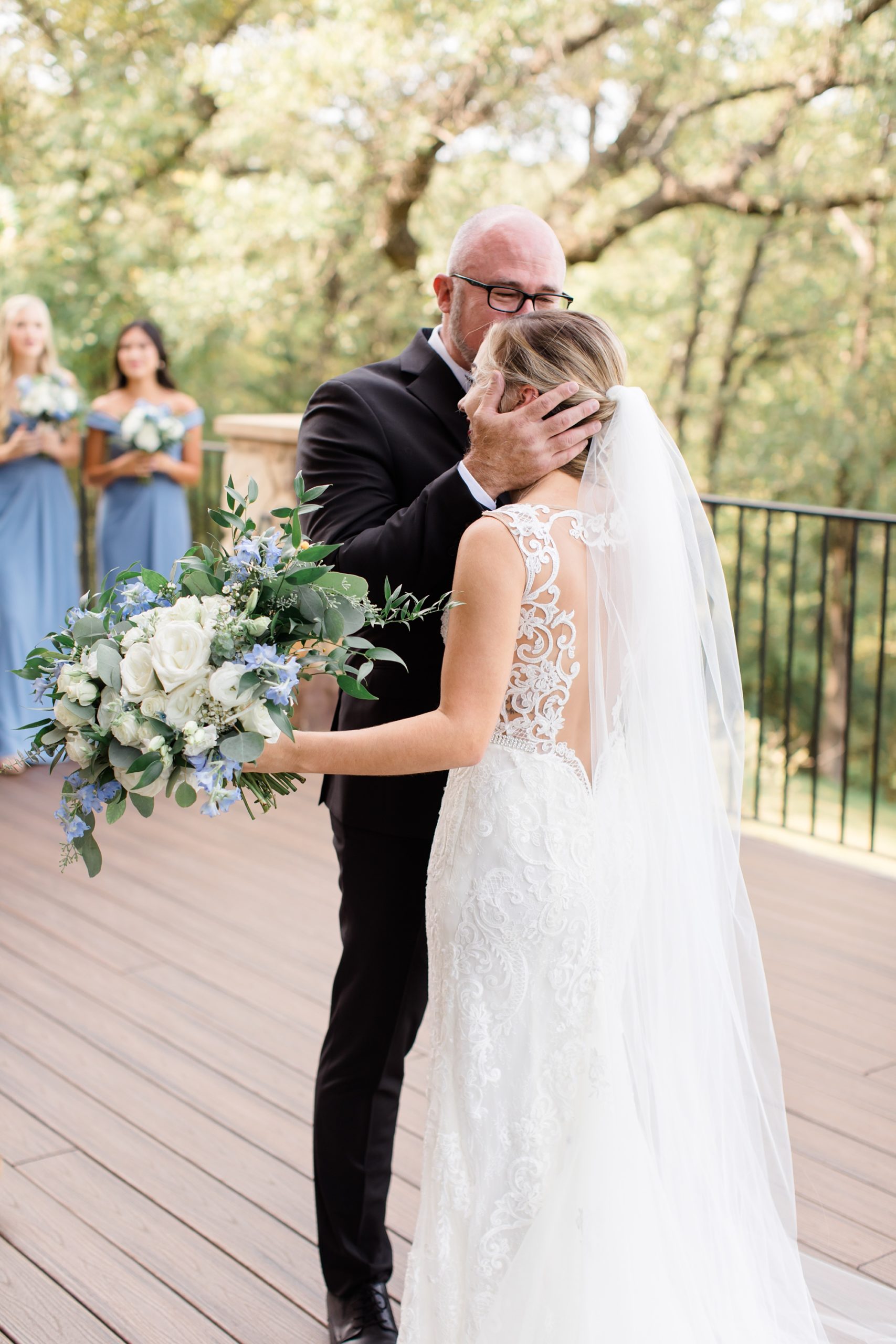 dad kisses daughter during first look