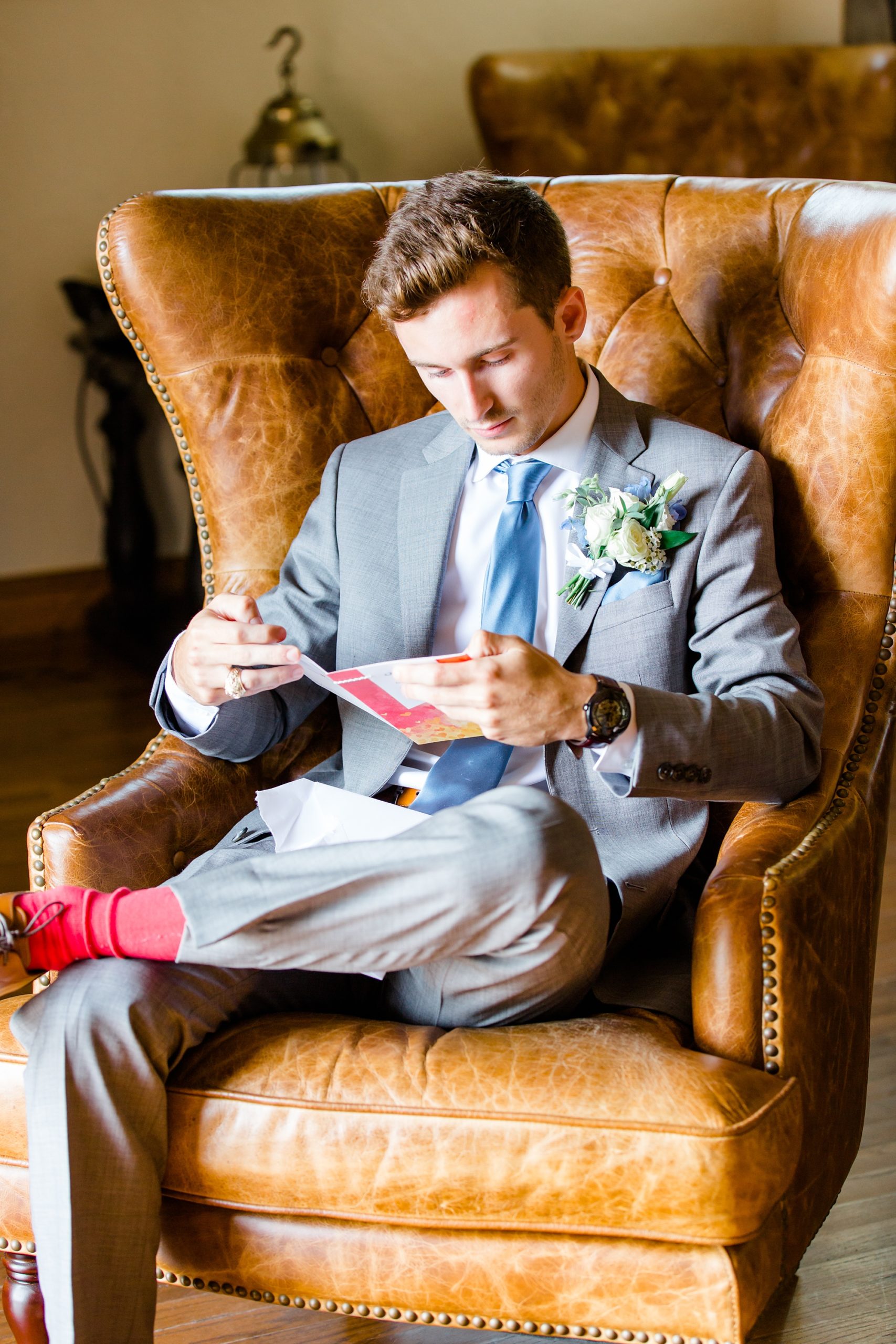 groom reads letter from bride before The Lodge wedding