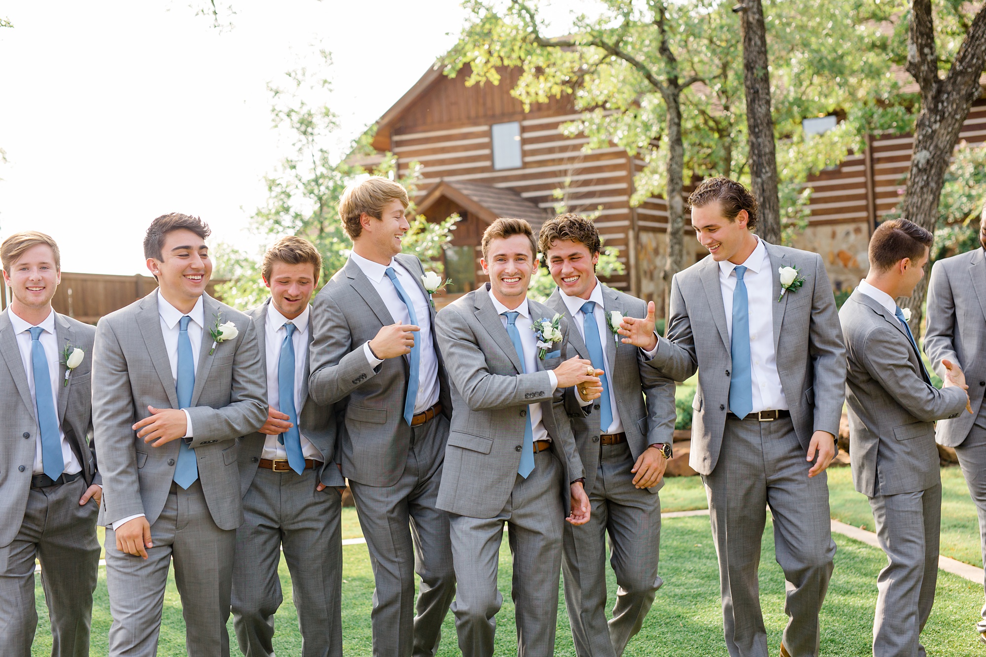 groomsmen goof off during portraits at The Lodge