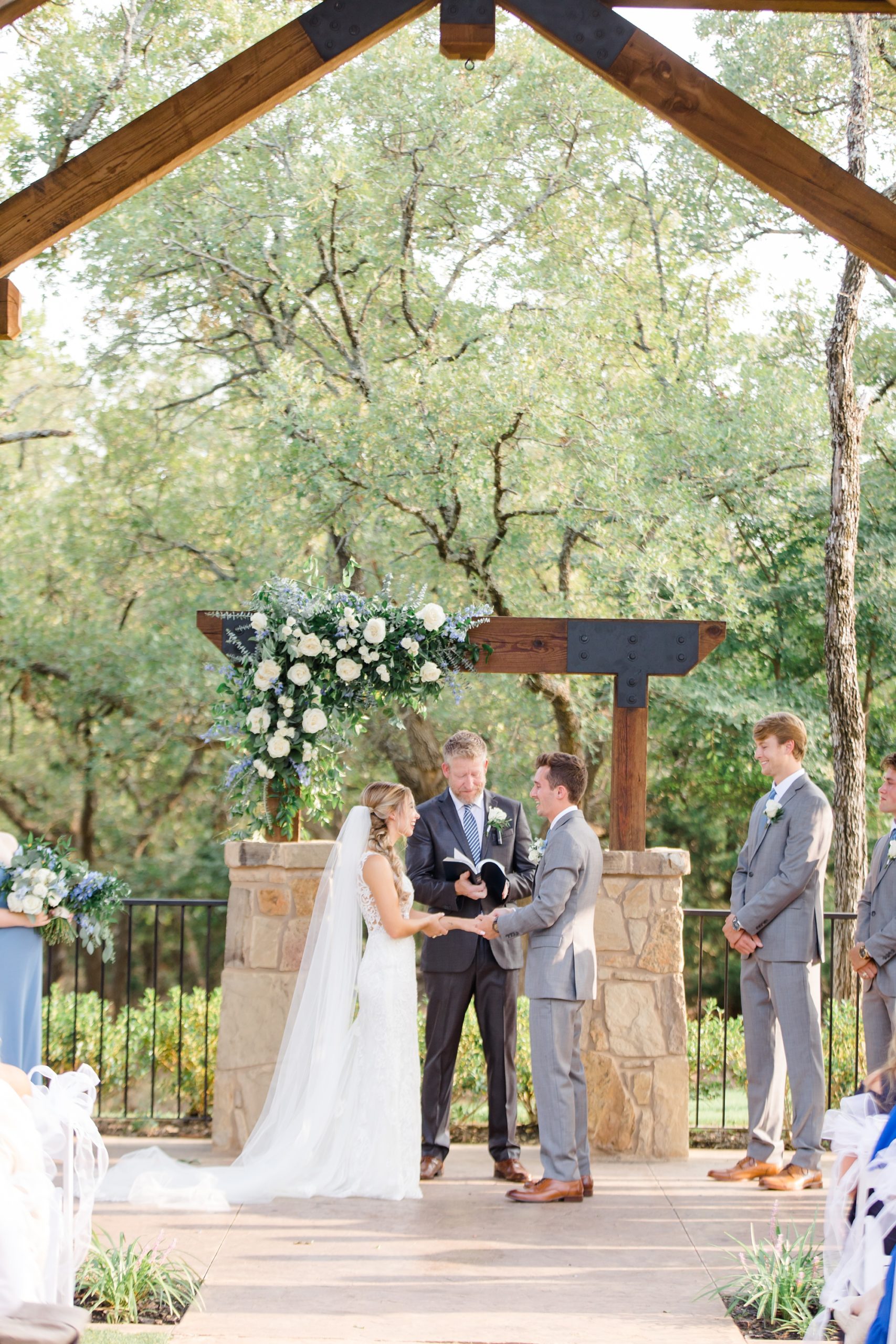 Aubrey TX wedding ceremony under arbor at The Lodge