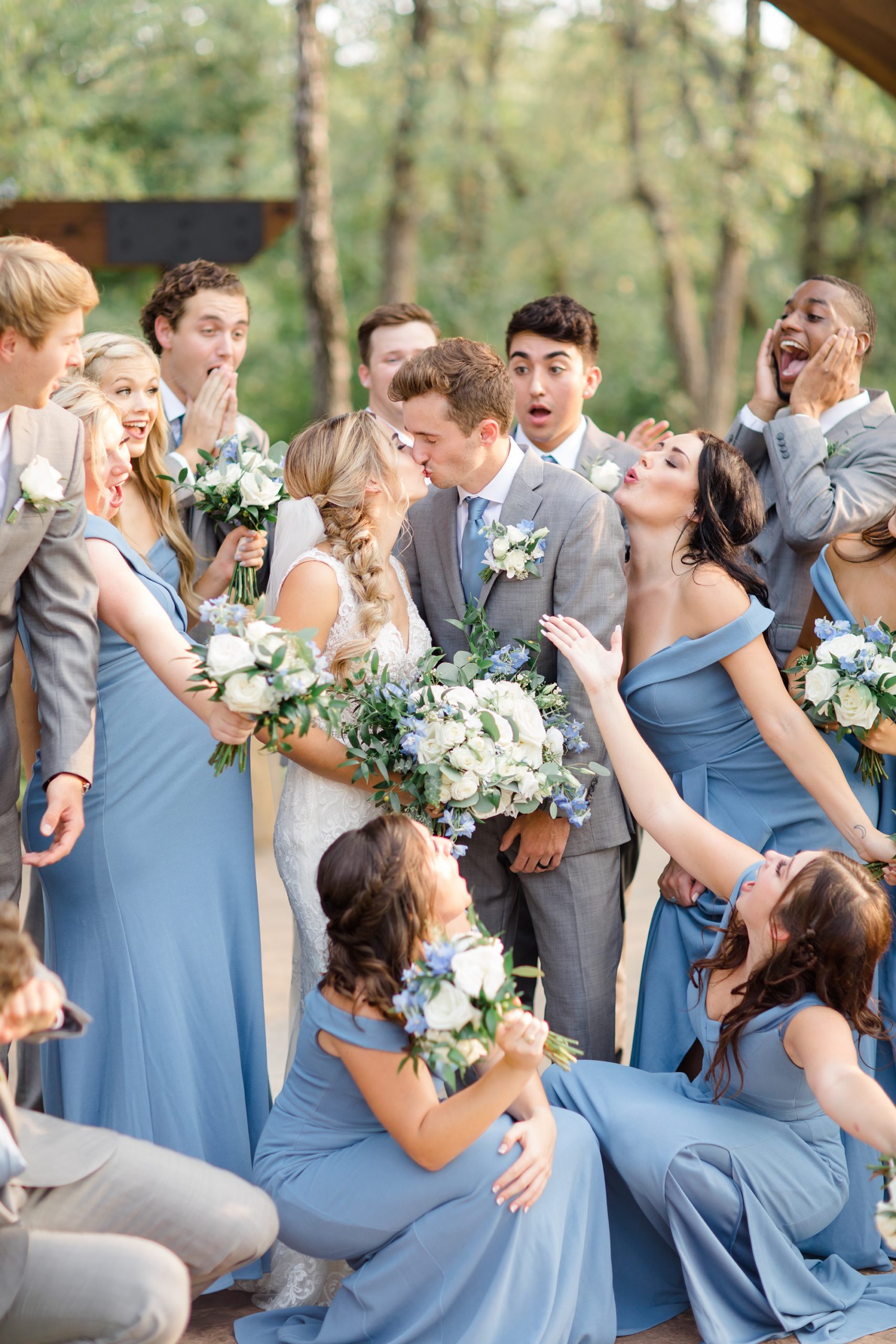 bridal party poses with newlyweds