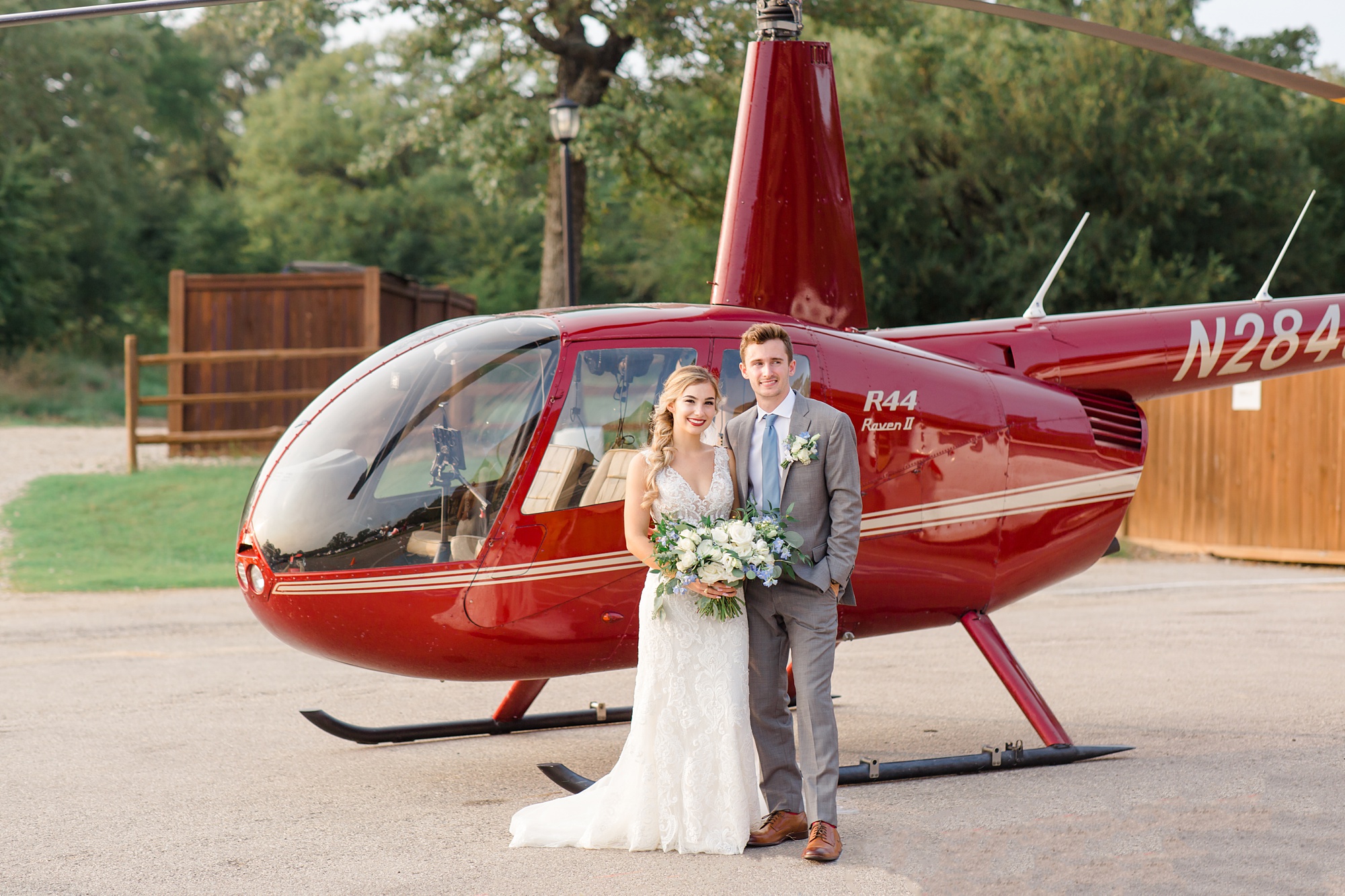 wedding portraits with red helicopter at The Lodge