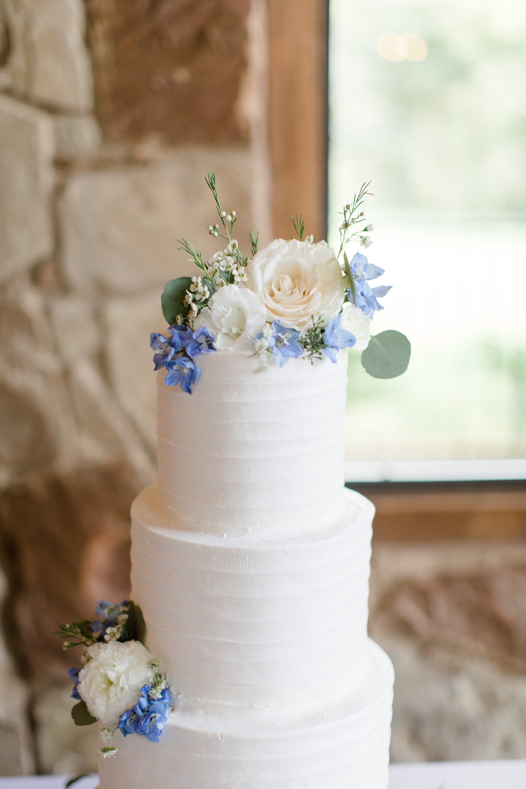 wedding cake with simple flower topper