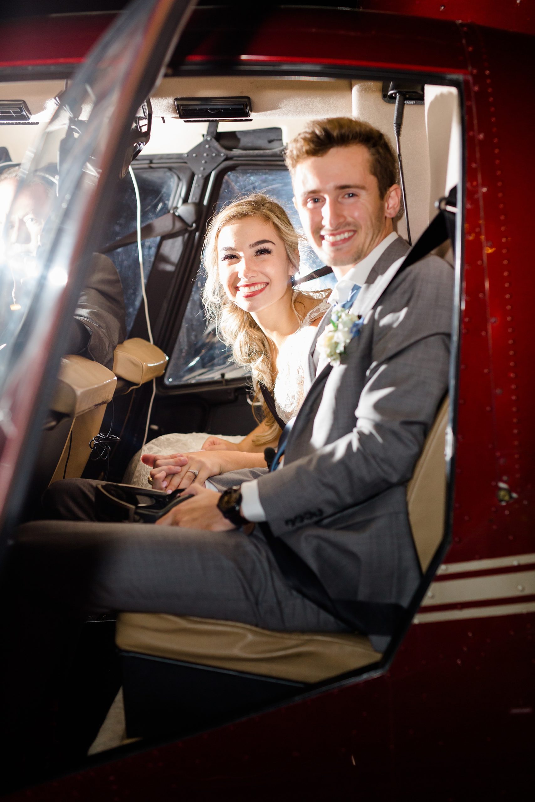 bride and groom leave wedding in helicopter
